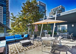 Atria Condos San Diego - roof top deck with BBQ & fireplace areas